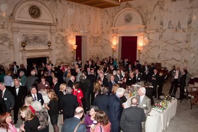 An image of a cocktail reception and dinner at the Metropolitan Club in New York City.