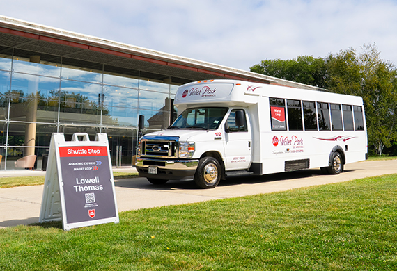 Image of shuttle bus in front of Lowell Thomas.