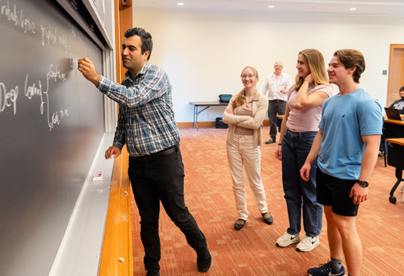 Faculty mentor Dr. Reza Sadeghi, Assistant Professor of Computer Science, works with students as part of the Statistical Mathematics and Research Training (SMART) REU program. Photo by Nelson Echeverria/Marist University.