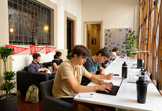 Image of Marist's First-year Dublin students working on their lap tops.