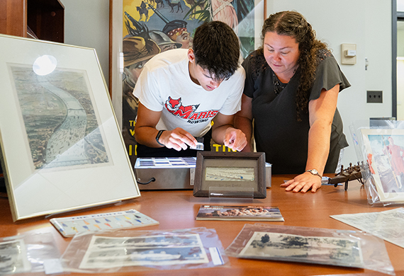 Image of Elizabeth Clarke and Julius Stratton working in the archives.