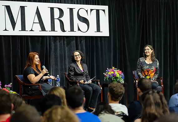 Image of presenters on stage at the Common Read Lecture.