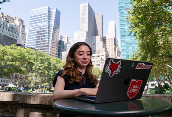Image of Marist student working on a laptop in Manhattan's Bryant Park.