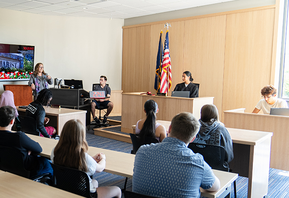Image of a class in the Jerome and Tina Pickett Mock Courtroom at the Dyson Center.
