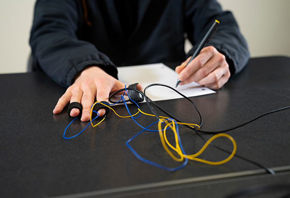 Psychology student using neurological equipment