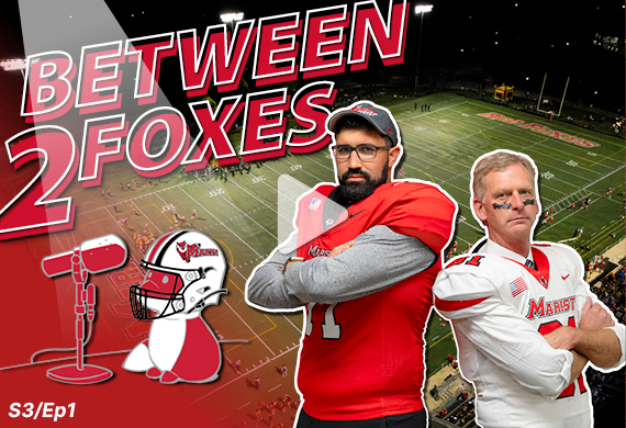 Image of Coach Willis and President Weinman in football gear. 