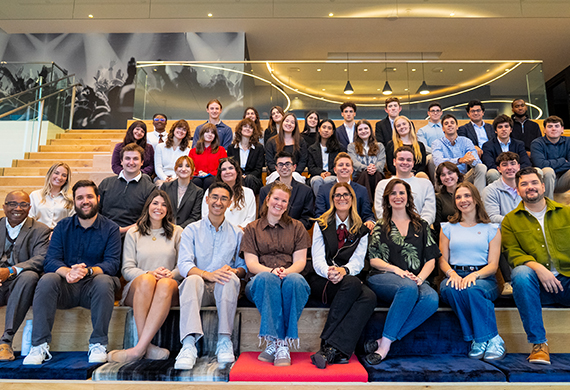 Group image of students and alumni at Paramount.