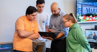 Image of students working in the marketing lab.