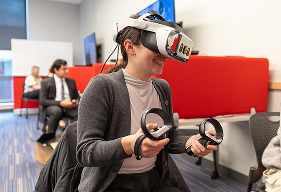 Marist University Image: Student uses VR and biometric technologies during iMotions training.