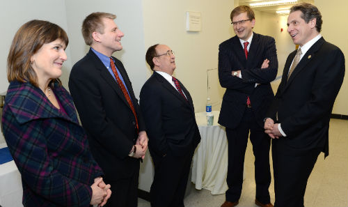 An image of Marist Poll Director Barbara Carvalho, VP for Academic Affairs Thomas Wermuth, MIPO Director Lee Miringoff, Executive Vice President Geoff Brackett, and Governor Cuomo