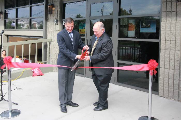 An image of President David Yellen and County Executive Marc Molinaro at the ribbon cutting for 51 Fulton