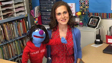 Image of Erin Berthold and a puppet.