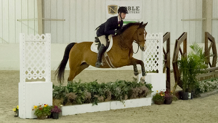 Photo of Marist equestrian team member competing