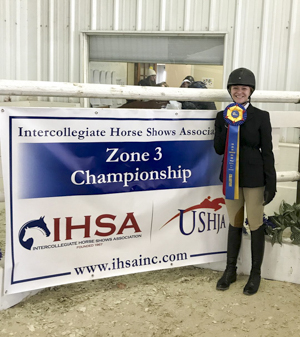 Photo of equestrian team member with award
