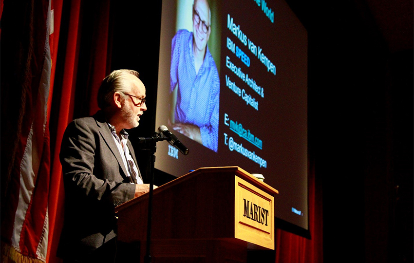 Image of Dr. Roger Norton, dean of school of computer science and mathematics at podium