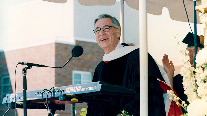 Fred Rogers sings to audience