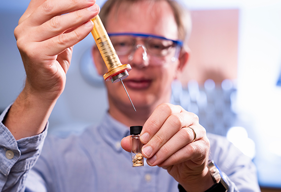 Chemistry professor Dr. Neil Fitzgerald exhibits part of barley malting process