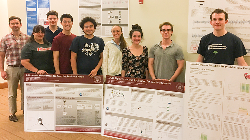 Joint student students pose with their research