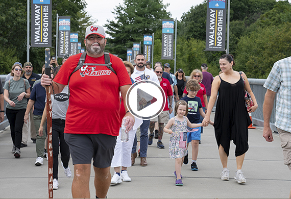 Tommy Zurhellen walks through main gate of Marist campus