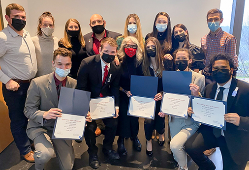 Dr. Helen Rothberg (front row, center), the winning team and other participants in the fall 2021 war game competition. The game focused on issues in the cosmetics industry.