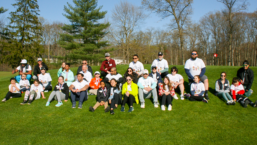 DPT students, local volunteers, and participating families at the adaptive golf clinic. Photo courtesy of Dr. Yvonne Egitto