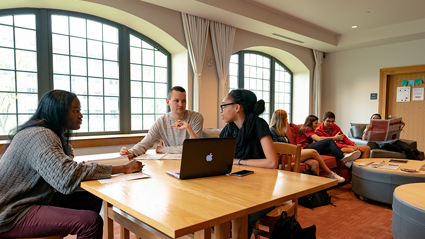 marist students sitting in the common area of a residence hall