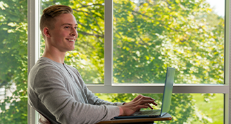 Image of Marist University student sitting in class for Online Summer and Winter Sessions. 