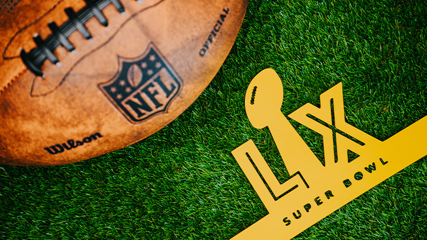 NFL football on turf field. Super Bowl photo by kovop58/AdobeStock.