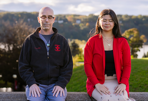 Allan Tibbetts and student participant from Train Your Brain Course practicing mindful breathing outside the Marist Rotunda. Photo by Nelson Echeverria/Marist College.