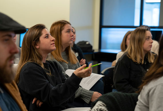 Image of students involved in classroom discussion.