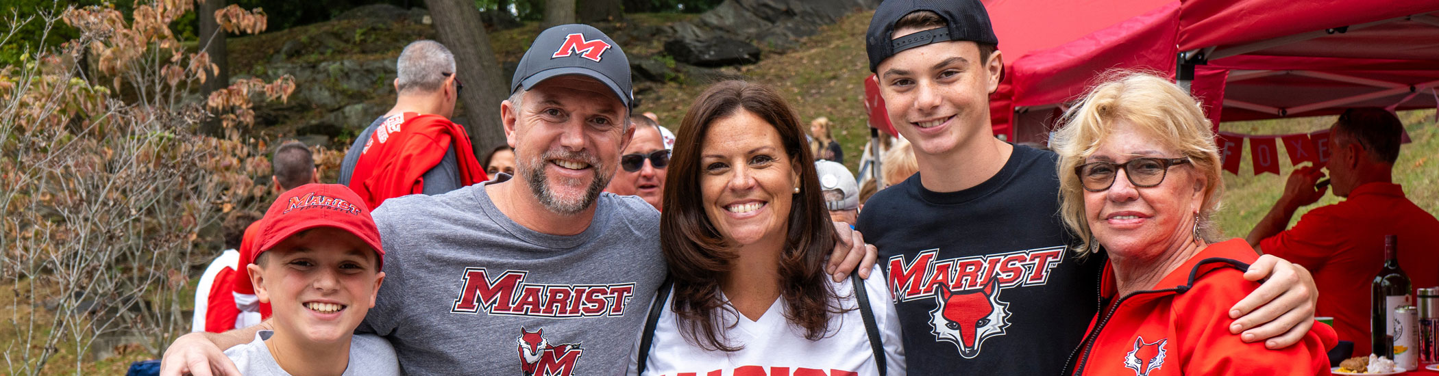 Image of a Marist University family posing for a photo on family weekend.