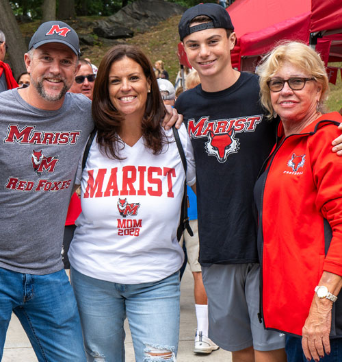 Image of a Marist University family posing for a photo on family weekend.