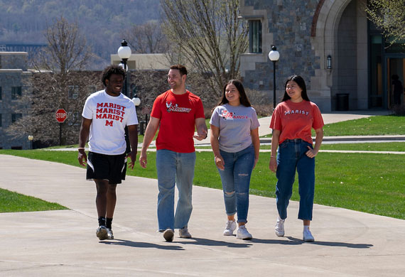 Image of Marist University students walking on campus in spring.