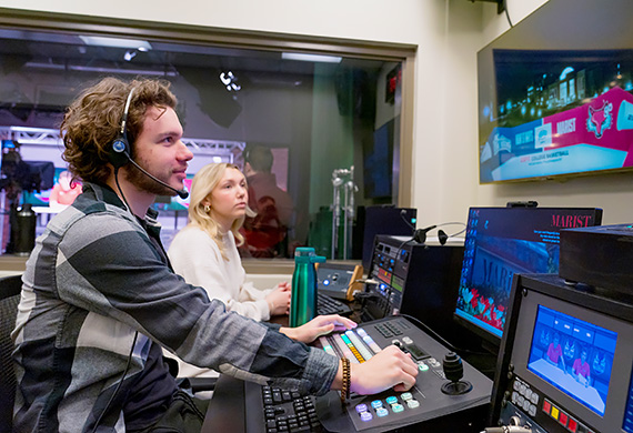 Image of student working behind the scenes for the Red Fox Report.