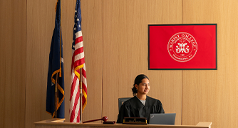 Image of student portraying Judge in Marist's Mock Courtroom.