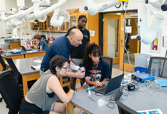 Image of Marist University Professor, Kevin Henry, with pre-college programs students. 