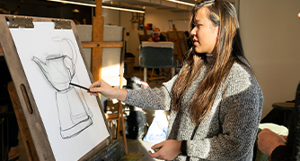 Image of student at canvas drawing
