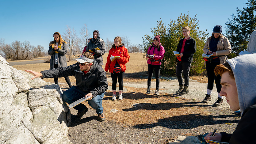 Dr. Zion Klos teaches environmental science students at Minnewaska State Park. Photo by Carlo de Jesus/Marist University. 