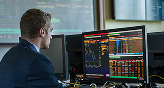 A man working seriously in front of the computer