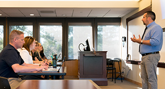 Image of Marist University students sitting in class for the Division of Extended Learning.