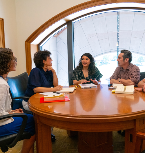 Image of faculty in conversation.