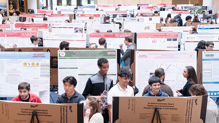 Image of Students, faculty, and staff gather in the Dyson Center atrium to discuss their research and to explore the research of their peers. Photo by Nelson Echeverria/Marist University.