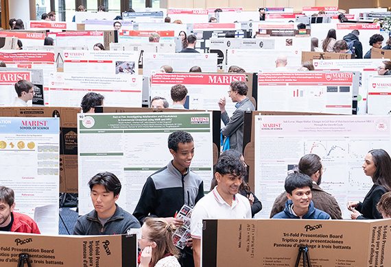 Students, faculty, and staff gather in the Dyson Center atrium to discuss their research and to explore the research of their peers. Photo by Nelson Echeverria/Marist University.