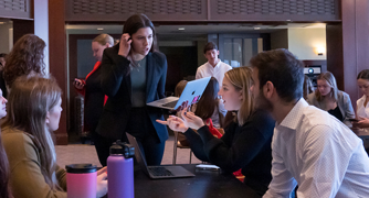 Image of students gathered for a North Road Communications meeting.