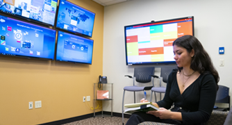 Image of a student working in the Center for Social Media at Marist University.