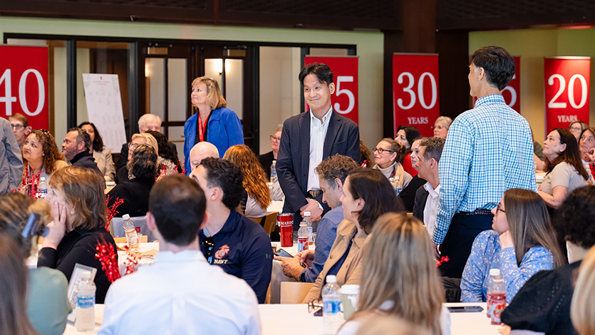 From left: Controller Christina Kearney, Dr. Byunghoon Jin, and Dr. John Cary stand for recognition of their 10 years of service during the April 27 Milestone and Farewell Reception event in The Cabaret. 