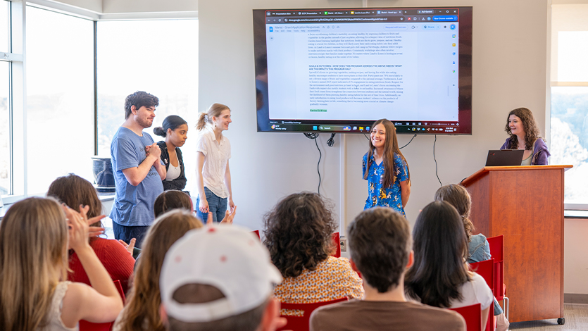 Image students receiving feedback from Land to Learn on their project. Photo by Benson Delaney ‘27/Marist University.