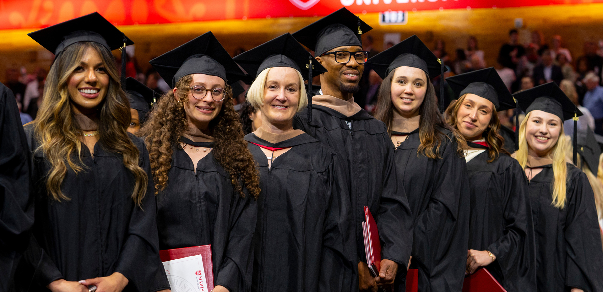 Students lined up in regalia for commencement