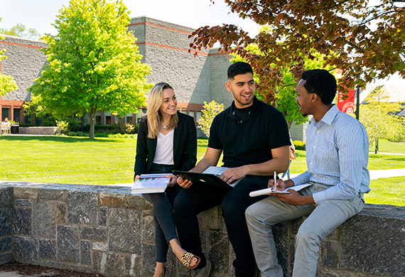 Image of three Marist students working outside