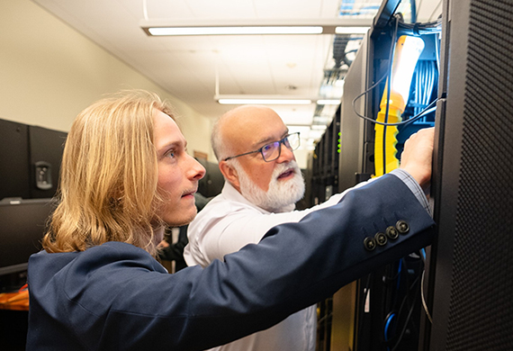 Image of Noah Yurasko and Professor Chris Algozzine working in the Enterprise Computing Research Lab.
